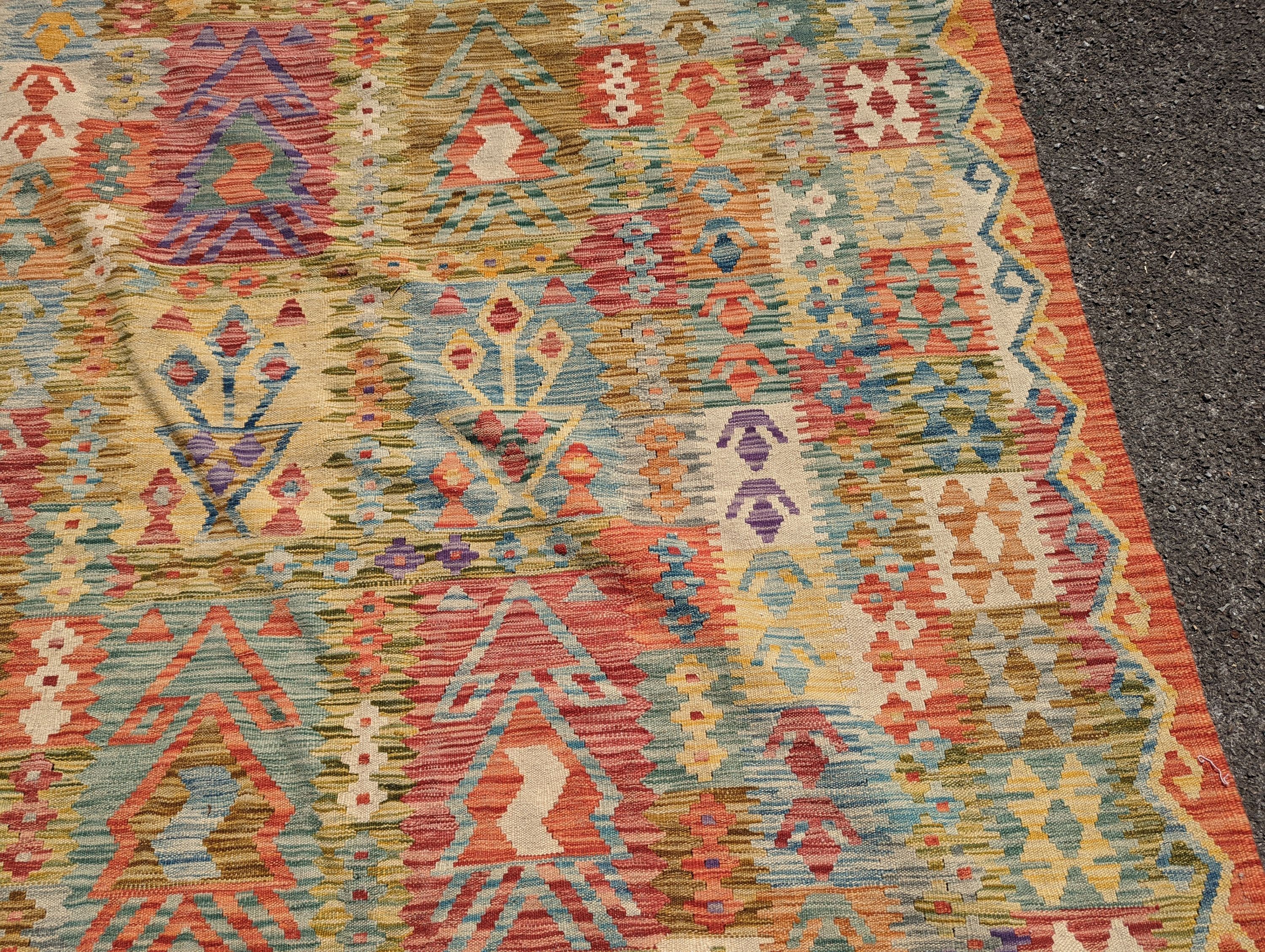 An Anatolian polychrome geometric flatweave Kilim carpet, 290 x 210cm